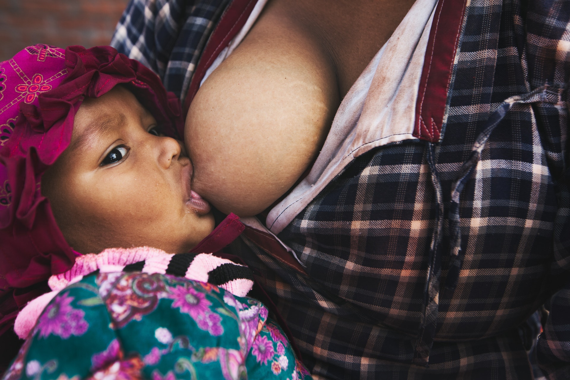 a mother breastfeeding her child